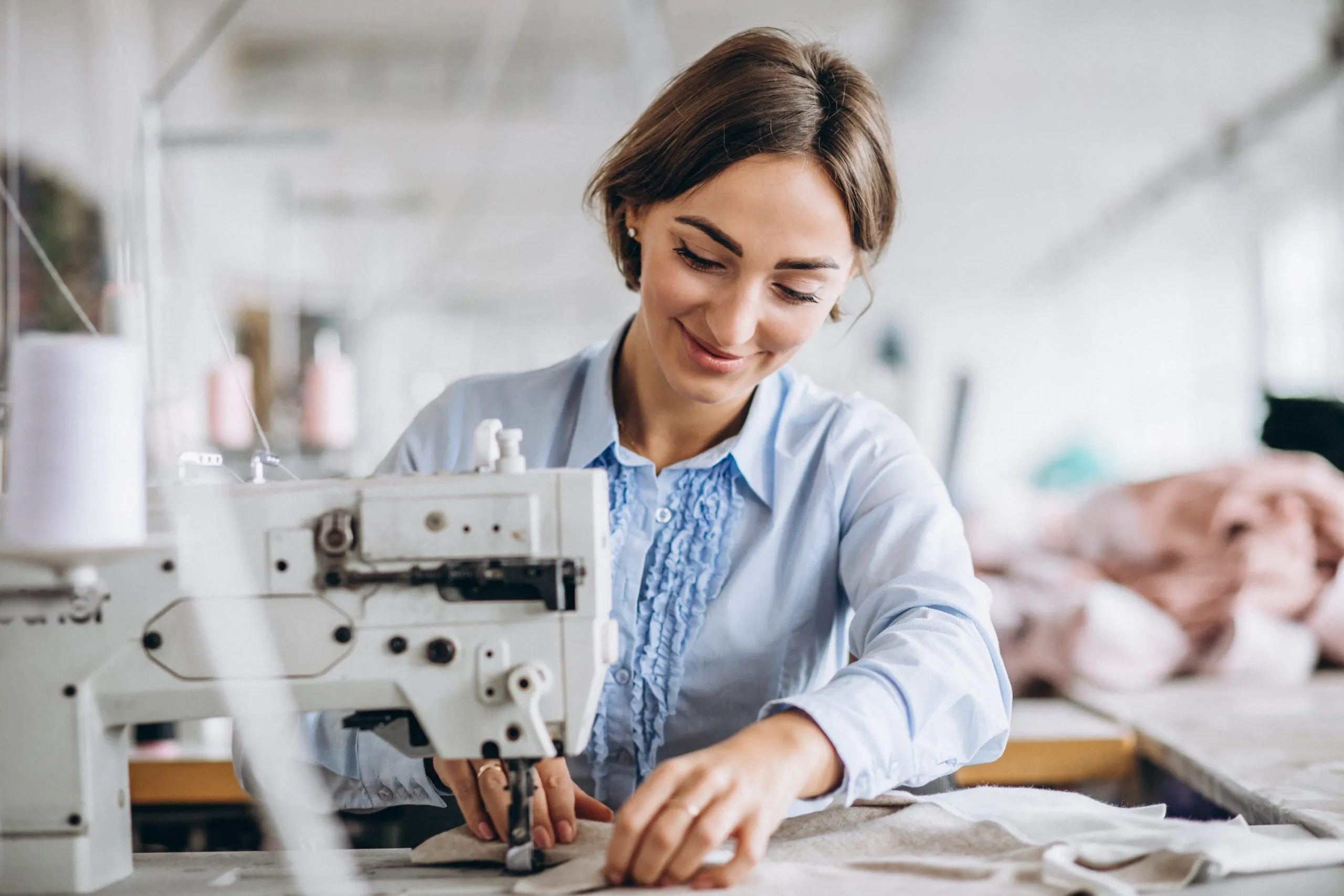 woman tailor working sewing fact